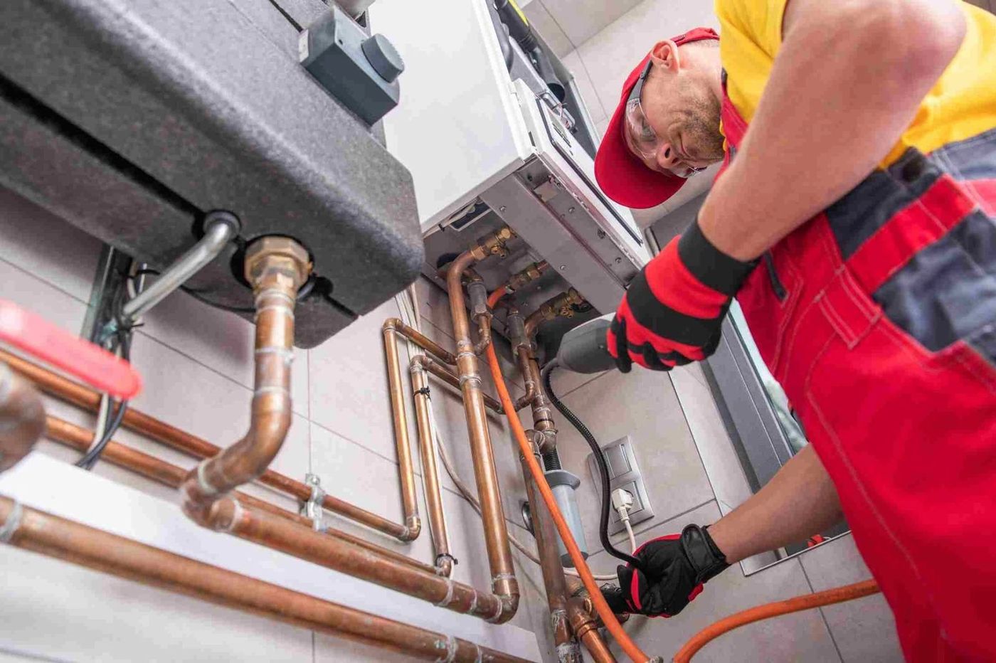 AdsFlair plumbing and gas engineer client servicing a boiler and copper pipework