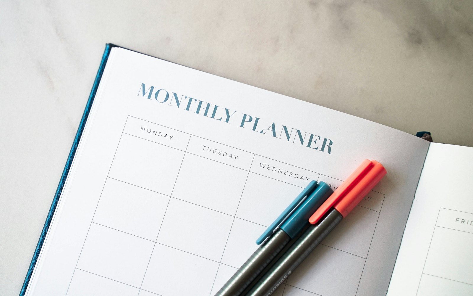 Planner and pens for budgeting