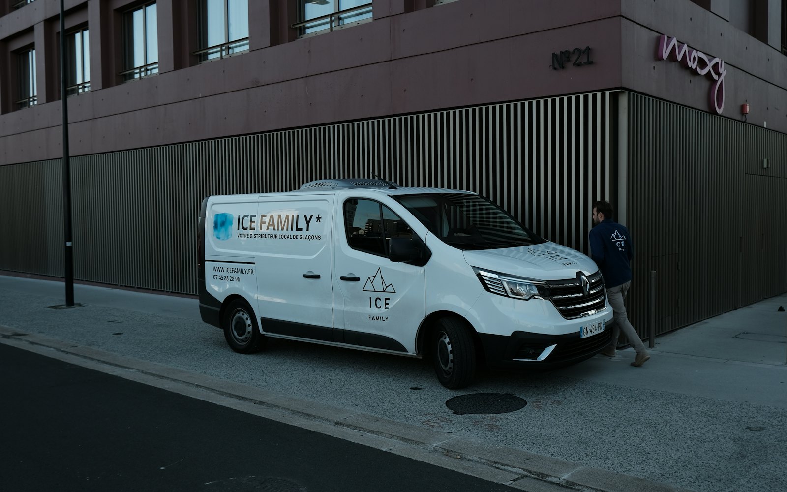 White tradesman van parked on a street